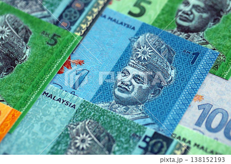 Malaysian ringgit paper banknotes pile on table. Malaysia MYR currency money bills in big amount. Concept of economics, taxation and banking in Malaysia Malaysian ringgit paper banknotes pile on table. Malaysia MYR currency money bills in big amount. Concept of economics, taxation and banking in Malaysia 138152193