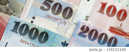 Taiwanese dollar paper banknotes pile on table. Taiwan TWD currency money bills in big amount. Concept of economics, taxation and banking in Taiwan 138152199