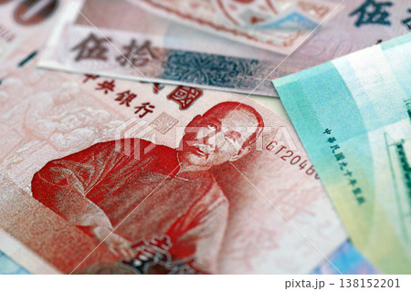 Taiwanese dollar paper banknotes pile on table. Taiwan TWD currency money bills in big amount. Concept of economics, taxation and banking in Taiwan 138152201