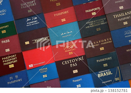 Big amount of passports of various different countries. Covers of expired passports close up. Travel documents for tourism 138152781