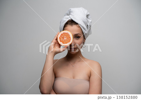 Woman preparing for a natural skincare routine, fresh grapefruit as natural ingredient for healthy glowing skin and beauty treatments at home Woman preparing for a natural skincare routine, fresh grapefruit as natural ingredient for healthy glowing skin and beauty treatments at home 138152880