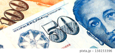 Singapore Dollar currency money bills. SGD currency banknotes in bunch with different denomination close up Singapore Dollar currency money bills. SGD currency banknotes in bunch with different denomination close up 138153396