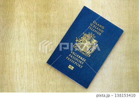 Icelandic passport on table close up. Official identification document book for citizens of Iceland. Concept of travel and tourism in Iceland Icelandic passport on table close up. Official identification document book for citizens of Iceland. Concept of travel and tourism in Iceland 138153410