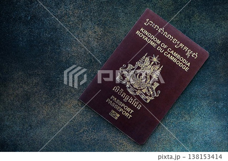 Cambodian passport on table close up. Official identification document book for citizens of Cambodia. Concept of travel and tourism in Cambodia 138153414