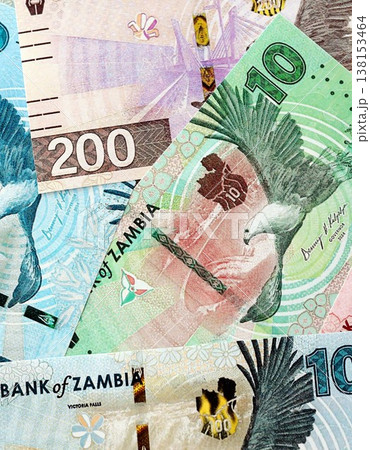 Zambian kwacha money bills pile on table. Zambia banknotes of ZMW currency close up. Concept of business, economy and banking in Zambia Zambian kwacha money bills pile on table. Zambia banknotes of ZMW currency close up. Concept of business, economy and banking in Zambia 138153464