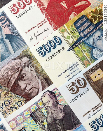 Icelandic krona money bills pile on table. Iceland banknotes of ISK currency close up. Concept of business, economy and banking in Iceland Icelandic krona money bills pile on table. Iceland banknotes of ISK currency close up. Concept of business, economy and banking in Iceland 138153540