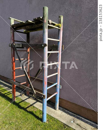 Old scaffolding against the background of the facade 138153623