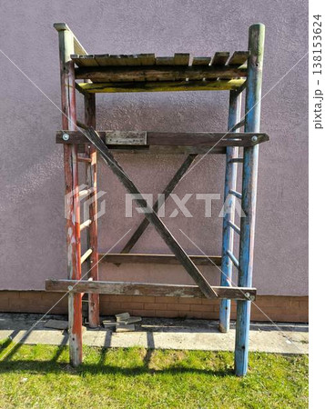 Old wooden scaffolding against the wall 138153624