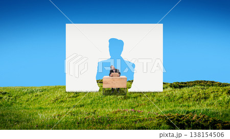 Businessman sitting at desk inside human silhouette cutout in landscape Businessman sitting at desk inside human silhouette cutout in landscape 138154506