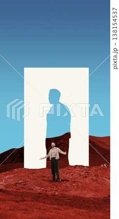 Man standing in red landscape under human silhouette cutout shape 138154537