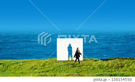 Businesswoman walking past human silhouette paper cutout on grass near ocean. 138154550