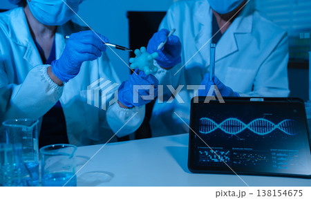 Healthcare professional holding Coronavirus COVID-19 vaccine in laboratory study and analyze scientific sample of Coronavirus antibody. Healthcare professional holding Coronavirus COVID-19 vaccine in laboratory study and analyze scientific sample of Coronavirus antibody. 138154675