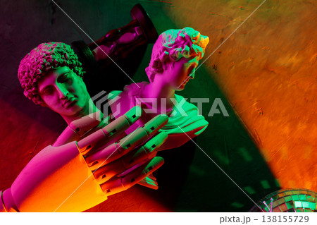 Classical sculpture busts with robotic hand illuminated by neon pink and green lighting Classical sculpture busts with robotic hand illuminated by neon pink and green lighting 138155729