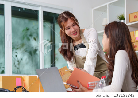 Small business owners managing e-commerce operations 138155845