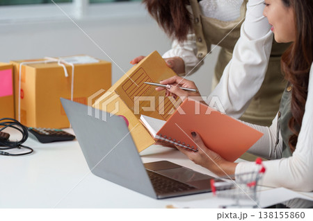 E-commerce team organizing shipment logistics 138155860