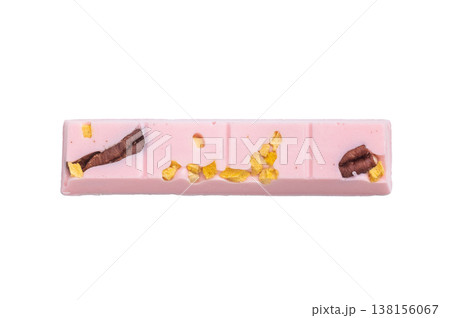 Pink ruby craft chocolate bar with dried citrus peel and cacao nib style toppings on white background artisan confectionery 138156067