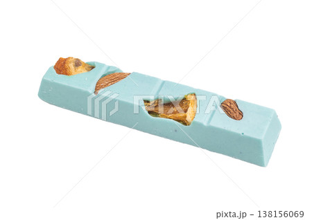 Blue pastel craft chocolate bar with almond pieces on white background artisan handmade gourmet confectionery 138156069