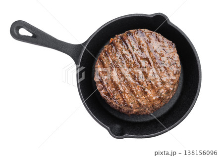 Grilled beef and lamb hamburger patty with seared crust and juicy texture in cast iron skillet. Cooked mixed meat on isolated background. 138156096