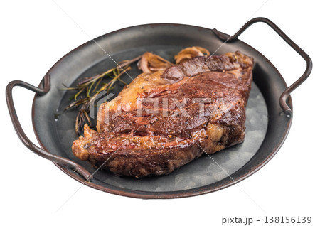 Seared beef chuck eye steak in metal pan with rosemary and salt. Tender cooked beef meat top view.. 138156139