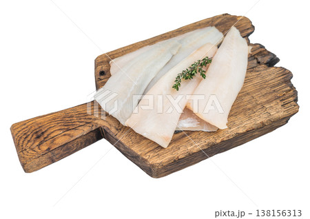 Raw marine white fish fillet pieces cod hake or pollock on plate isolated on white background fresh seafood ingredient Raw marine white fish fillet pieces cod hake or pollock on plate isolated on white background fresh seafood ingredient 138156313