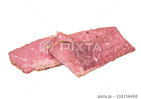 Thin sliced pastrami arranged in layers on a clean white background. Smoked deli beef with marbled texture, cured meat for sandwiches, cooking and food preparation. 138156408