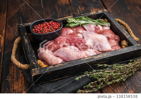 Gourmet game meat: Premium poultry Raw quail breast fillets portions ready for seasoning. Top view of a rich, rustic culinary scene. 138156538
