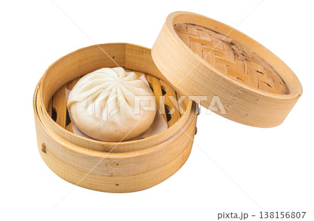 Nikuman steamed bun served in bamboo steamer, fluffy Asian dumpling with soft dough on light background with copy space Nikuman steamed bun served in bamboo steamer, fluffy Asian dumpling with soft dough on light background with copy space 138156807