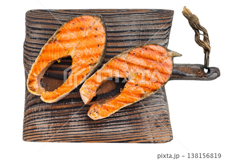 Grilled sockeye salmon steaks on wooden board isolated on clean light background 138156819