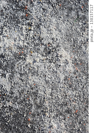 Texture of road salt on dark asphalt surface Texture of road salt on dark asphalt surface 138157117
