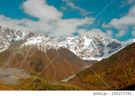 A trekking trail to the Shkhara Glacier from Ushguli. An autumn valley in the Caucasus Mountains. 138157191