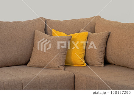 Textile decorative pillows on sofa corner 138157290