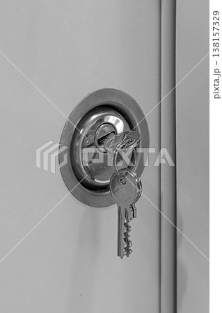 Key in a door keyhole Key in a door keyhole 138157329