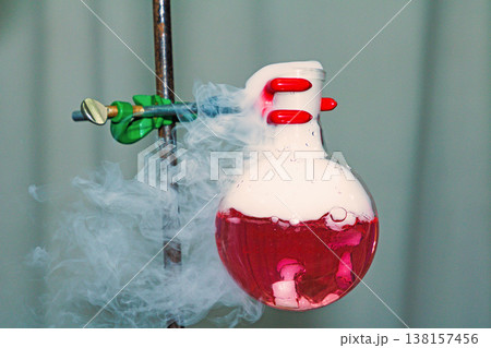 Red potion smoke in laboratgory 138157456