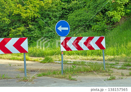 Traffic signs outside on the road 138157565