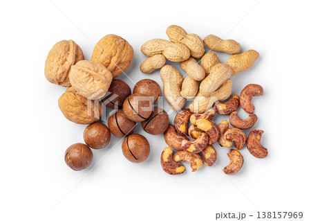 Variety of nuts with nutshell, walnut, macadamia, cashew, peanuts, top view, isolated on white background Variety of nuts with nutshell, walnut, macadamia, cashew, peanuts, top view, isolated on white background 138157969