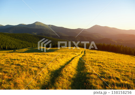 Amazing scene in summer mountains with rural road Amazing scene in summer mountains with rural road 138158256