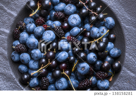 Mixed blue berries in ceramic bowl 138158281