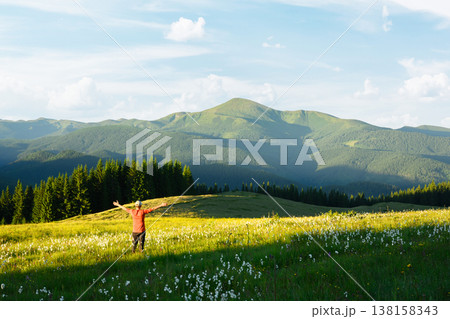 Tourist stay on grassy meadows with blooming white flowers Tourist stay on grassy meadows with blooming white flowers 138158343