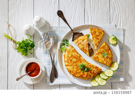 spanish potato omelette, tortilla on a plate spanish potato omelette, tortilla on a plate 138158987