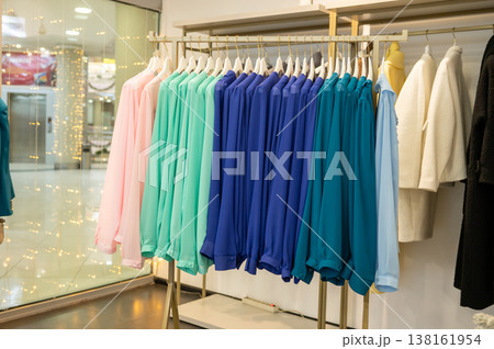 Colorful blouses on rack display in fashion store Colorful blouses on rack display in fashion store 138161954