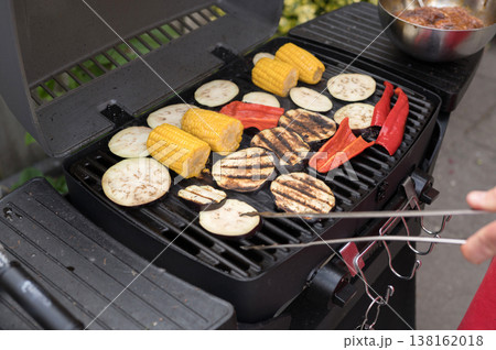 Grilled vegetables on outdoor bbq with corn, eggplant, and peppers Grilled vegetables on outdoor bbq with corn, eggplant, and peppers 138162018