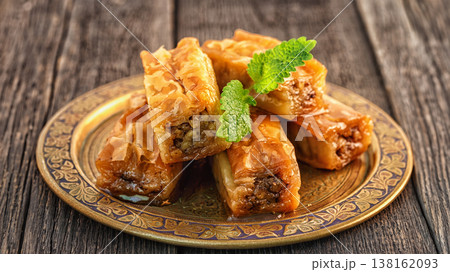 Traditional arabic dessert Baklava with honey and walnuts. 138162093