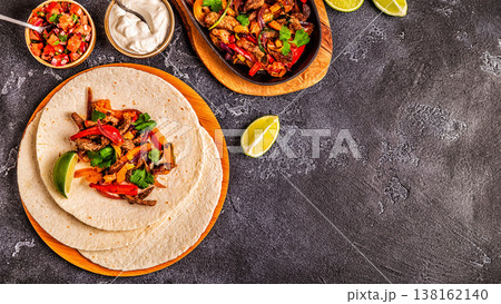 FAJITAS with colored pepper and onions, served with tortillas. 138162140