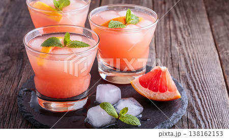 Grapefruit cocktail with ice and mint. Grapefruit cocktail with ice and mint. 138162153