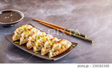gyoza or dumplings snack with soy sauce 138162160