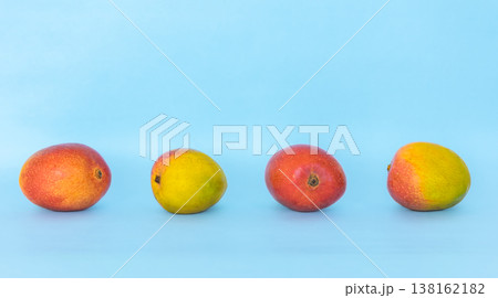 Organic whole mangoes on colorful background. 138162182