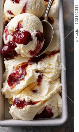 Cherry Balsamic Ripple Cherry swirl ice cream scooped in metal serving tray Cherry Balsamic Ripple Cherry swirl ice cream scooped in metal serving tray 138162333