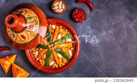 Vegetable tagine with almond and chickpea couscous Vegetable tagine with almond and chickpea couscous 138162643