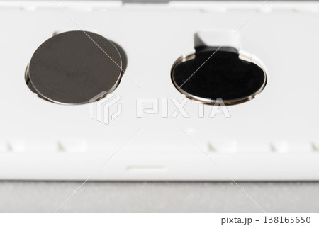 Button cell batteries and electronic device...の写真素材 [138165650] - PIXTA