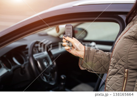 Driver Showing Breathalyzer From Open Car Window. Promoting Safe And Sober Driving. Driving license revocation for alcohol Driver Showing Breathalyzer From Open Car Window. Promoting Safe And Sober Driving. Driving license revocation for alcohol 138165664